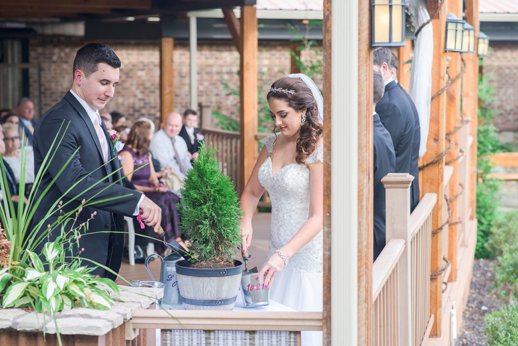 bride and groom plant a tree for their unity ceremony