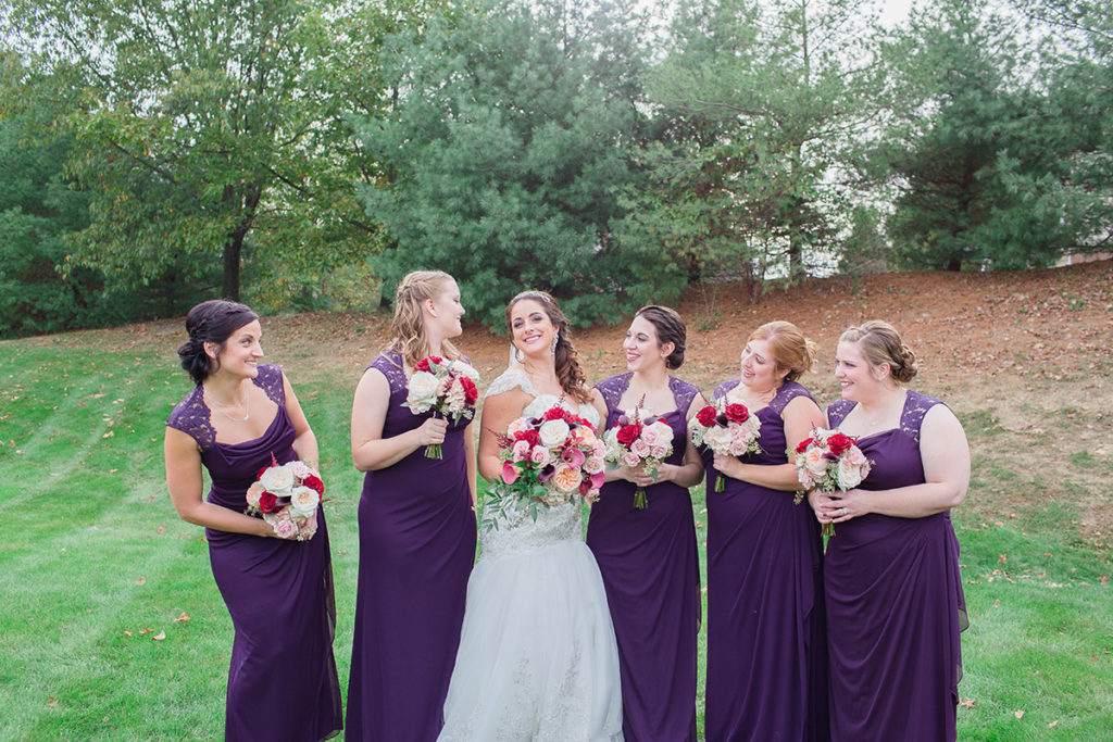bridesmaids stand with bride